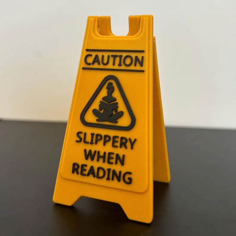 CAUTION Slippery While Reading Folding Sign