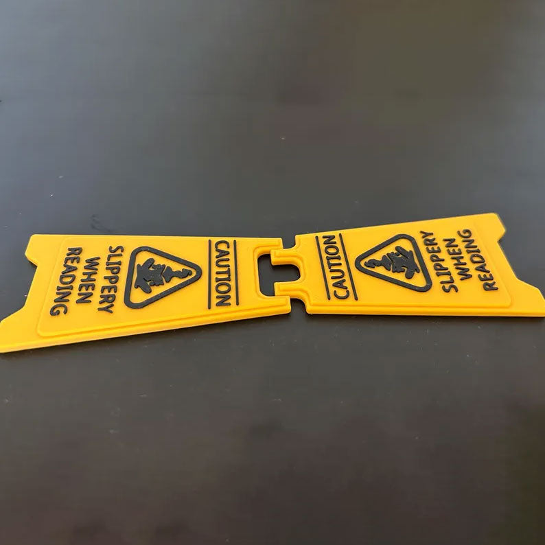 CAUTION Slippery While Reading Folding Sign